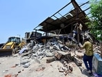 Mumbai, India - May 12, 2026: Heavy police security was deployed at the Mumbai Port Authority colony in Darukhana, Coal Bunder, as authorities began demolishing homes alleged to be illegal, some of which residents claim have existed since 1949, leading to evictions, in Mumbai, India, on Tuesday, May 12, 2026. (Photo by Anshuman Poyrekar/Hindustan Times) (Anshuman Poyrekar/HT Photo) Mumbai, India - May 12, 2026: Heavy police security was deployed at the Mumbai Port Authority colony in Darukhana, Coal Bunder, as authorities began demolishing homes alleged to be illegal, some of which residents claim have existed since 1949, leading to evictions, in Mumbai, India, on Tuesday, May 12, 2026. (Photo by Anshuman Poyrekar/Hindustan Times) (Anshuman Poyrekar/HT Photo)