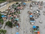 This aerial photograph shows houses covered heavily in sludge in the aftermath of flash floods at Devighat in Nepal's Nuwakot district.