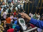 Pune, India - Sept. 12, 2019:Official from Maharashtra Pollution Control Board recorded a noise level during the Ganpati immersion procession at Vishrambag chowk in Pune, India, on Thursday, September 12, 2019. (Photo by Milind Saurkar/Hindustan Times) (Milind Saurkar/HT Photo)