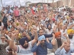 Punjab government employees raising slogans during the statewide strike outside the deputy commissioner’s office in Amritsar on August 27. (Sameer Sehgal/HT)