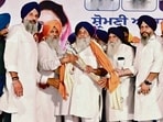 Shiromani Akali Dal president Sukhbir Singh Badal being honoured by SAD leader Bikram SIngh Majithia and others during rally at Baba Bakala in Amritsar, on Friday. (HT Photo)