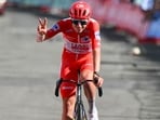 Tadej Pogacar crashed during Vuelta Stage 8, suffered shoulder and facial injuries, and was taken to hospital.. (Photo by JOSE JORDAN / AFP)