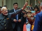 PM Modi greets the Indian community at an event in Tashkent.