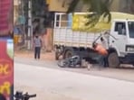 A video of the incident has gone viral on social media, showing a man lying on a road as two persons attack him with sharp weapons.