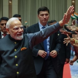 PM Modi greets the Indian community at an event in Tashkent.