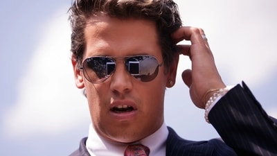 Milo Yiannopoulos, known for his conservative views, was taken into custody by ICE for exceeding his visa duration. (X)