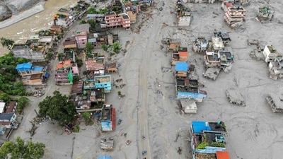This aerial photograph shows houses covered heavily in sludge in the aftermath of flash floods at Devighat in Nepal's Nuwakot district. (AFP) This aerial photograph shows houses covered heavily in sludge in the aftermath of flash floods at Devighat in Nepal's Nuwakot district. (AFP)