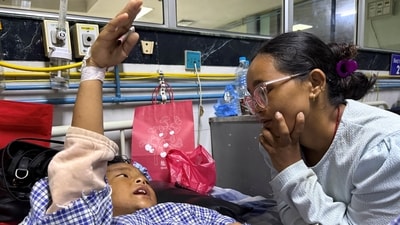 Zoyal Ghale, 8, who was airlifted from Rasuwa, speaks with his mother Matti Maya Tamang, inside a hospital in Kathmandu, Nepal. (REUTERS)