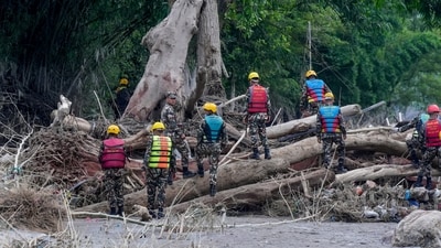 A Nepal Army official conduct a search and rescue operation along side a river area at Charaudi, in Dhading district, Nepal. (PTI) A Nepal Army official conduct a search and rescue operation along side a river area at Charaudi, in Dhading district, Nepal. (PTI)