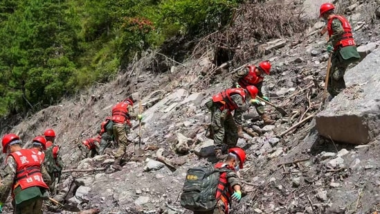 Nepal-Tibet flash floods: Rescuers from the People's Armed Police Force work at the mudslide-hit area near Gyirong Port in Gyirong County, in Xigaze, southwest China's Tibet Autonomous Region on Friday.
