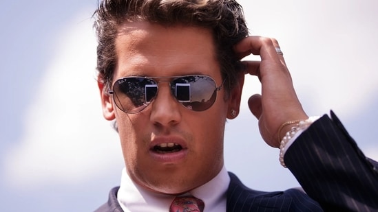Milo Yiannopoulos, known for his conservative views, was taken into custody by ICE for exceeding his visa duration.