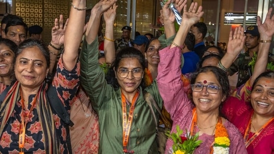 Relatives welcome 37 pilgrims from Raigad and Mumbai who were stranded in Nepal as they arrive safely at Mumbai airport today after returning from Kathmandu in mumbai, India, on Saturday, August 29, 2026.