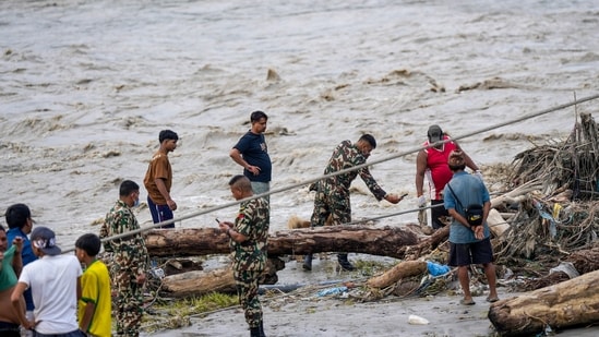 Nepal-Tibet flood LIVE: A Nepal Army official conduct a search and rescue operation along side a river area at Charaudi, in Dhading district, Nepal. Nepal-Tibet flood LIVE: A Nepal Army official conduct a search and rescue operation along side a river area at Charaudi, in Dhading district, Nepal.