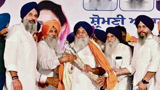 Shiromani Akali Dal president Sukhbir Singh Badal being honoured by SAD leader Bikram SIngh Majithia and others during rally at Baba Bakala in Amritsar, on Friday. (HT Photo)