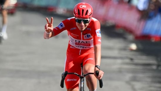 Tadej Pogacar crashed during Vuelta Stage 8, suffered shoulder and facial injuries, and was taken to hospital.. (Photo by JOSE JORDAN / AFP)