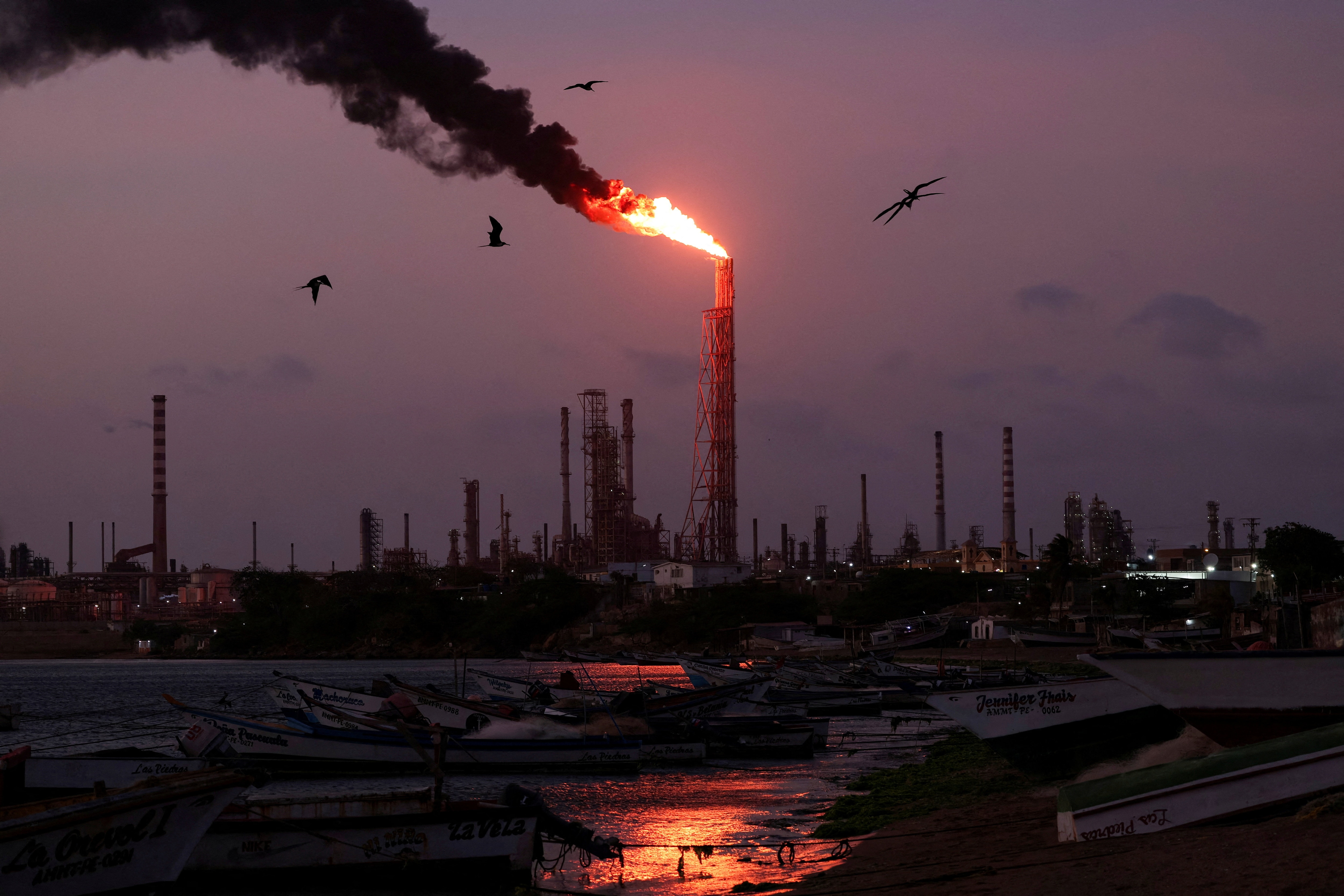 A gas flare burns at the Cardon refinery, part of the Paraguana Refining Center, as years of underinvestment, equipment failures and shortages have hampered fuel production in Venezuela, in Punta Cardon, Venezuela, May 6, 2026. (REUTERS)