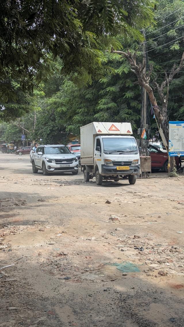 A dilapidated road in Sector 23 market on Saturday. (HT) A dilapidated road in Sector 23 market on Saturday. (HT)