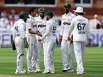 Pakistan's Mohammad Abbas celebrates after taking the wicket of England's Dan Lawrence with teammates 