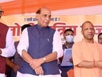 Defence minister Rajnath Singh, UP chief minister Yogi Adityanath and deputy CM Brajesh Pathak at an event in Lucknow on August 30. (HT photo)