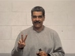 In the two photographs, Nicolas Maduro is wearing a grey tracksuit and making peace signs with his hands. (X/ Nicolas Maduro)