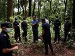 Police officers and officials inspect the site for a mass burial for the victims of the deadly flash floods and mudslides, in Chitwan, Nepal.(File Photo/Reuters)
