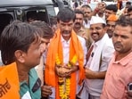 Maratha reservation activist Manoj Jarange Patil is welcomed by supporters upon his arrival, in Karad, Satara district, Maharashtra. 