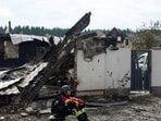 A rescuer rests next to a private house damaged by Russian drone strikes on Friday evening, amid Russia's attack on Ukraine, in Kyiv region, Ukraine August 30, 2026.(REUTERS)