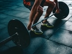 Lifting weights is essential to preserve muscle and bone strength.(Unsplash)
