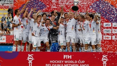 Gold medal winners, Germany, celebrate with the trophy on the podium during the World Cup Field Hockey competition in Wavre, Belgium (AP Photo/Geert Vanden Wijngaert) Gold medal winners, Germany, celebrate with the trophy on the podium during the World Cup Field Hockey competition in Wavre, Belgium (AP Photo/Geert Vanden Wijngaert)