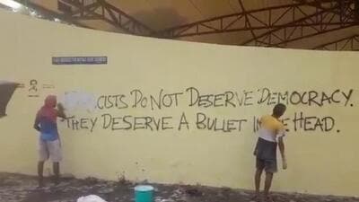 An old graffiti on the walls of the open air theatre that read, “Fascists do not deserve democracy. They deserve a bullet in the head,” was also covered with white paint. (X/Screengrab) An old graffiti on the walls of the open air theatre that read, “Fascists do not deserve democracy. They deserve a bullet in the head,” was also covered with white paint. (X/Screengrab)