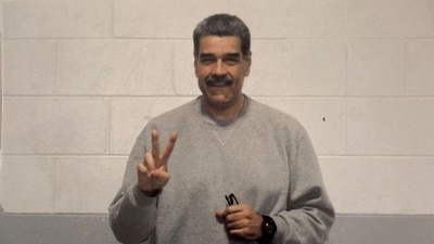 In the two photographs, Nicolas Maduro is wearing a grey tracksuit and making peace signs with his hands. (X/ Nicolas Maduro) In the two photographs, Nicolas Maduro is wearing a grey tracksuit and making peace signs with his hands. (X/ Nicolas Maduro)