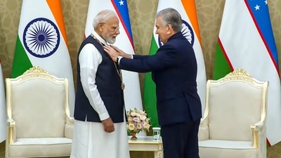 Prime Minister Narendra Modi being conferred with Uzbekistan's prestigious 'Oliy Darajali Do'stlik' by Uzbekistan President Shavkat Mirziyoyev, at the Kuksaroy Presidential Palace in Tashkent, Uzbekistan. (PTI) Prime Minister Narendra Modi being conferred with Uzbekistan's prestigious 'Oliy Darajali Do'stlik' by Uzbekistan President Shavkat Mirziyoyev, at the Kuksaroy Presidential Palace in Tashkent, Uzbekistan. (PTI)