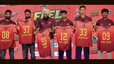 Players with their jersey during the event in Ludhiana on Sunday. (HT)