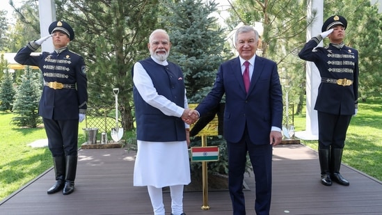 Prime Minister Narendra Modi and Uzbekistan President Shavkat Mirziyoyev shake hands after planting a tree at the Presidential Palace garden under the ‘Ek Ped Maa Ke Naam’ initiative of India and ‘Yashil Makon’ green efforts of Uzbekistan, in Tashkent on Sunday
