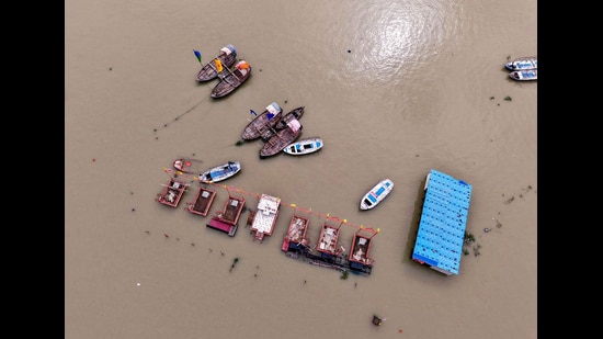 An aerial view of floating boats near the Sangam Ghat, inundated by the swollen waters of the Ganga and Yamuna rivers, in Prayagraj on Sunday. (ANI)