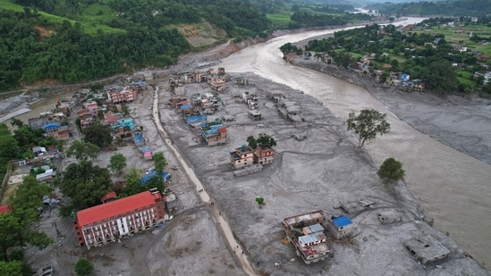 A drone view of the aftermath of flash flooding along the Trishuli River in the Devighat area of Nuwakot district, Nepal, Saturday, Aug. 29, 2026. (AP Photo/Rajesh Kumar Singh)