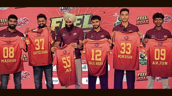 Players with their jersey during the event in Ludhiana on Sunday. (HT)