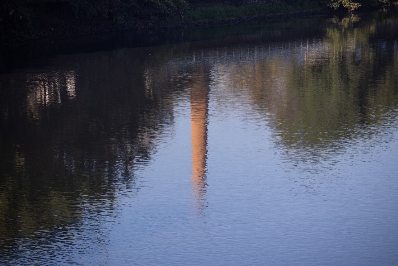 A former sugar mill is reflected in the Piracicaba River. A former sugar mill is reflected in the Piracicaba River.