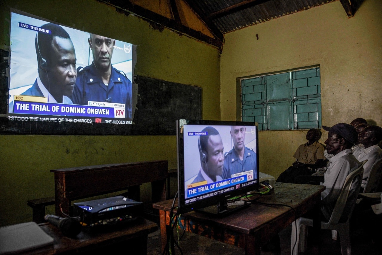 People in Uganda watch an ICC trial in 2016. People in Uganda watch an ICC trial in 2016.