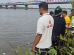 Rescue personnel conduct an operation at Mumbra’s Retibunder Creek after three men drowned on Sunday evening.