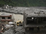 A vehicle and buildings near Trishuli river damaged and covered in mud following the August 26 deadly flash floods and a mudslide, at Betrawati Bazaar in Rasuwa district, Nepal. (REUTERS)