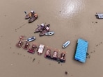 An aerial view of floating boats near the Sangam Ghat, inundated by the swollen waters of the Ganga and Yamuna rivers, in Prayagraj on Sunday. (ANI) An aerial view of floating boats near the Sangam Ghat, inundated by the swollen waters of the Ganga and Yamuna rivers, in Prayagraj on Sunday. (ANI)