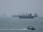 Vessels in the Strait of Hormuz are visible near the beach of Bandar Abbas, Iran.