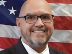 Mayor Ken Adams of Olive Branch, Mississippi, faced backlash after declining to lower the American flag for Dolly Parton, despite President Trump's directive.