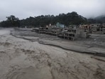 A drone view of the Trishuli river flowing past damaged buildings covered in mud after the deadly flash floods and mudslide, at Devighat, Nuwakot district, Nepal