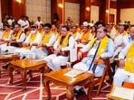 Uttarakhand CM Pushkar Singh Dhami and others listen to Prime Minister Narendra Modi's 'Mann Ki Baat' radio programme. 