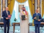 Turkish President Tayyip Erdogan, Saudi Crown Prince Mohammed bin Salman and Pakistan's Prime Minister Shehbaz Sharif pose after signing a joint defence agreement in Mecca, Saudi Arabia, August 7,(via REUTERS)