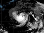 This satellite image released by NOAA shows Hurricane Karina strengthening off the southern tip of Baja California on Sunday, Aug. 30, 2026.