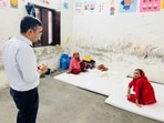 Varanasi DM interacting with people at a flood relief camp in a school on Monday (Rajesh Kumar/HT)