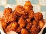 Chef Sanjeev Kapoor's air-fried chicken popcorn recipe takes only half an hour to make. 